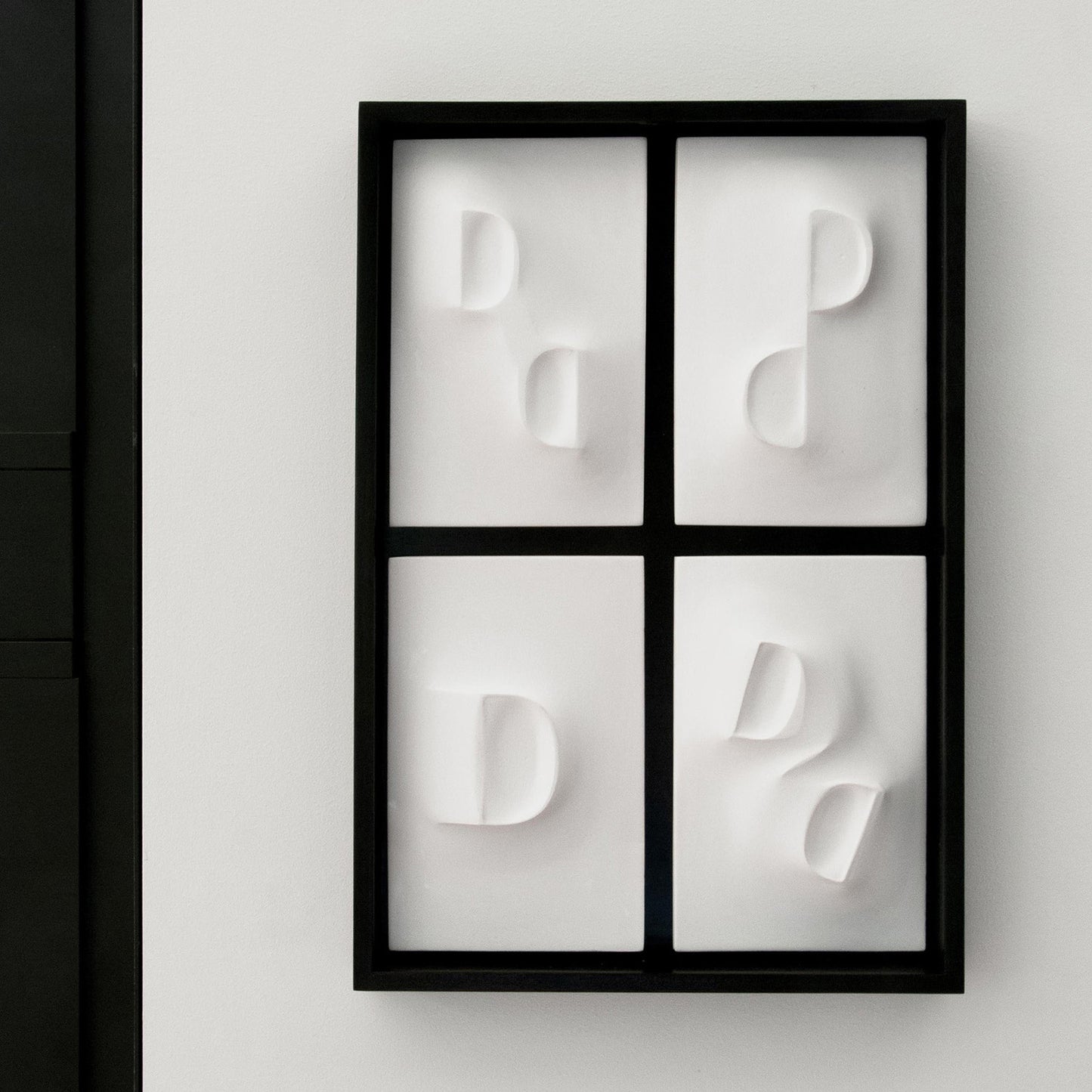 Dancing Balconies, a relief wall sculpture artwork framed in mahogant stain and a black background