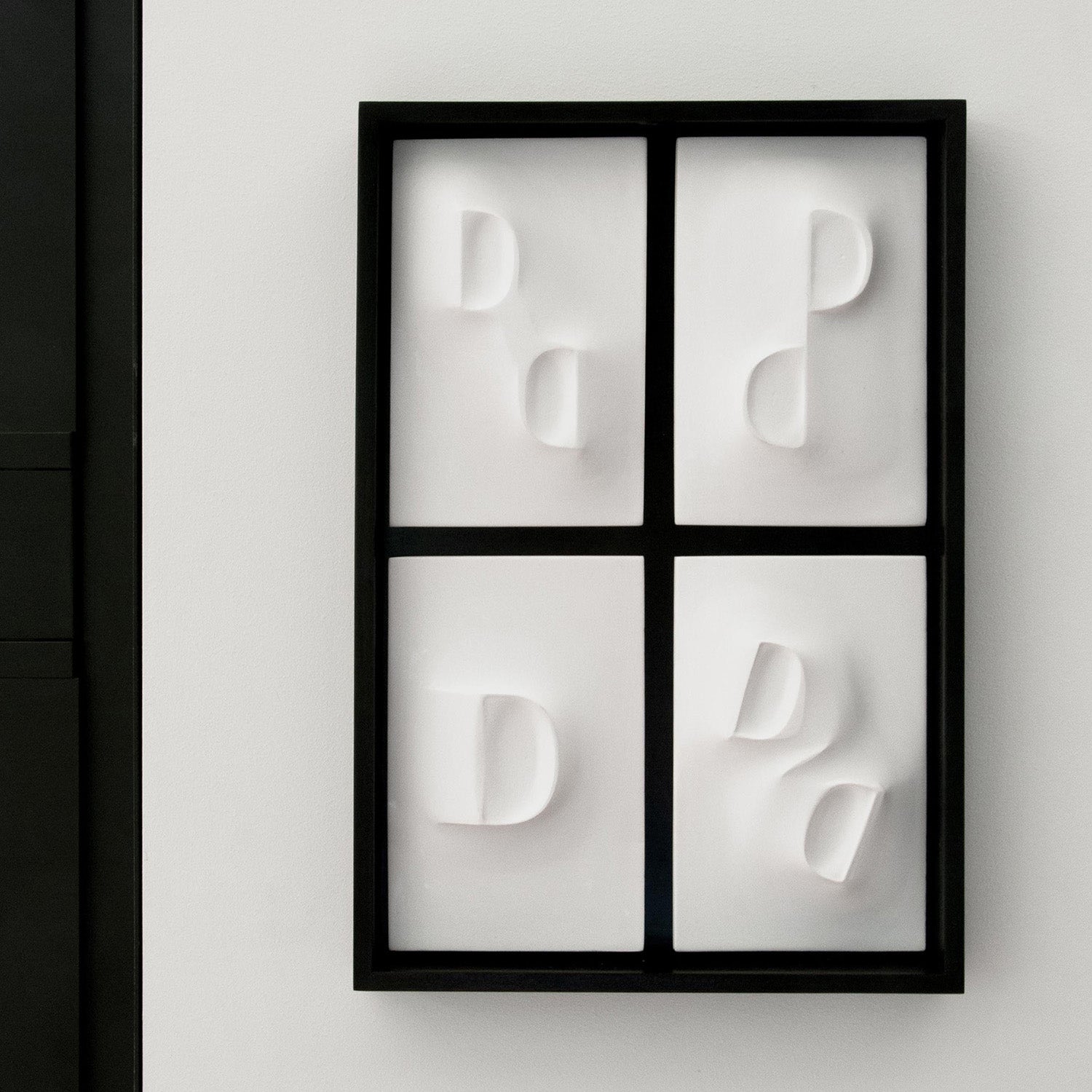 Dancing Balconies, a relief wall sculpture artwork framed in mahogant stain and a black background