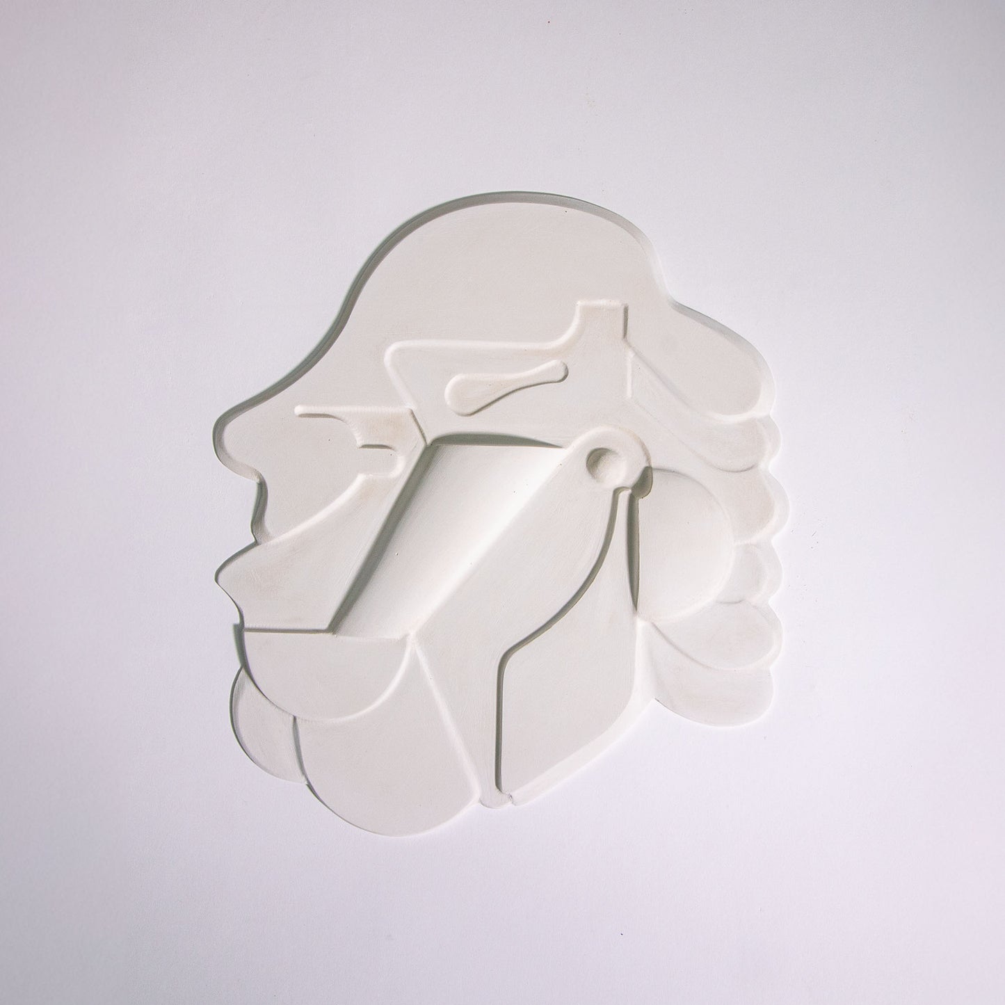 Mask 1, a relief artwork made from plaster, photographed against a white background