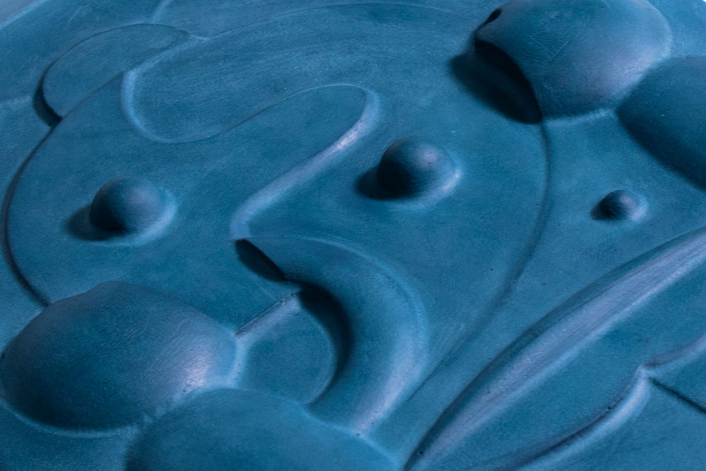 Close up photograph of mask 2, relief wall sculpture artwork