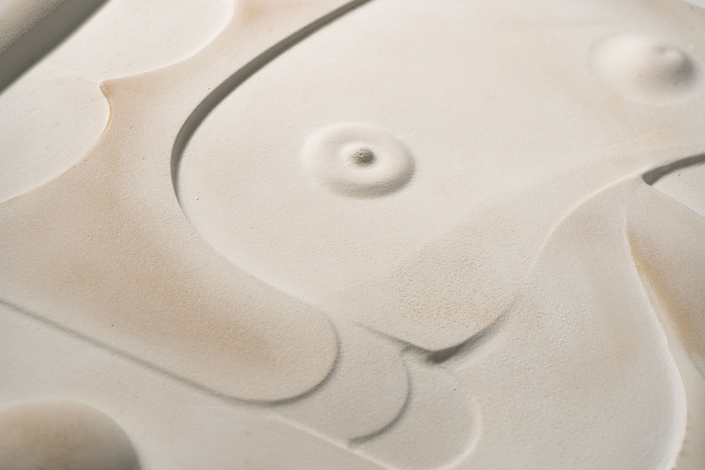 Close up photograph of Mask 3, relief wall sculpture artwork