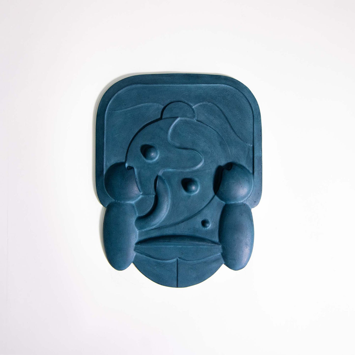 Mask 2, a blue relief artwork made from plaster photographed against a white background