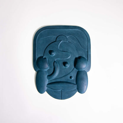 Mask 2, a blue relief artwork made from plaster photographed against a white background