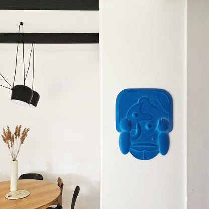 Mask 2, Relief Artwork made from blue plaster hung against a white wall unframed