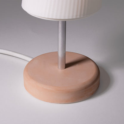 Terracota base of the Ora Premium table lamp photographed against a white background